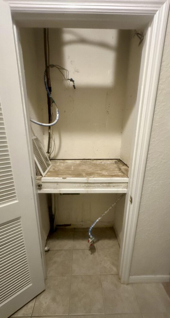 Mold growth visible inside an HVAC air handler closet in Volusia County, FL