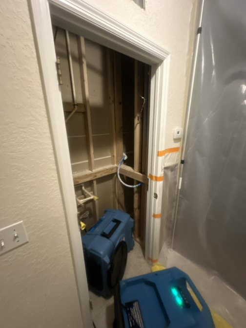 A HEPA air scrubber and commercial dehumidifier deployed by PUDDLES Restoration during a mold remediation job in Volusia County, FL
